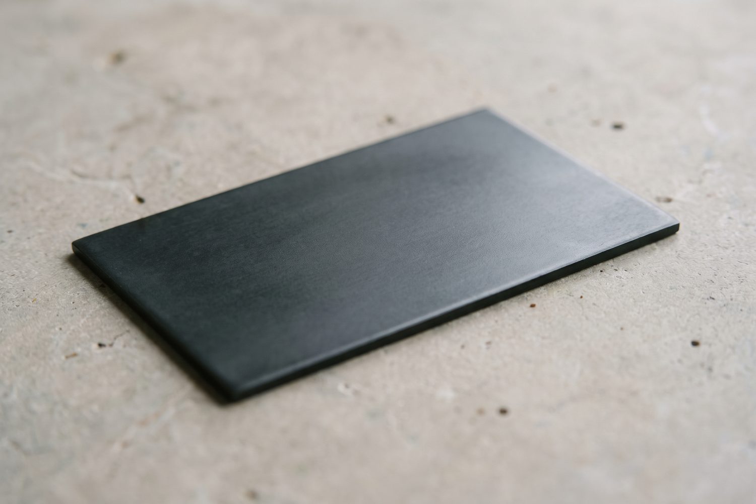 Macro of a waxed blackened steel surface