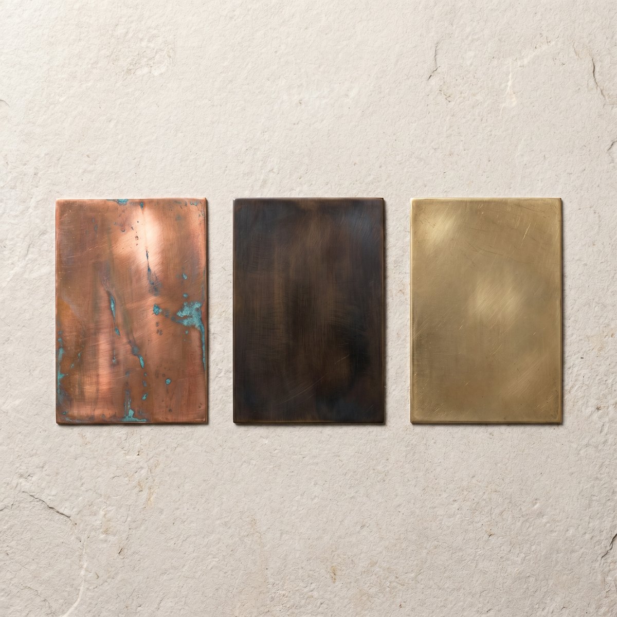 Copper, bronze and brass patina sample plates compared