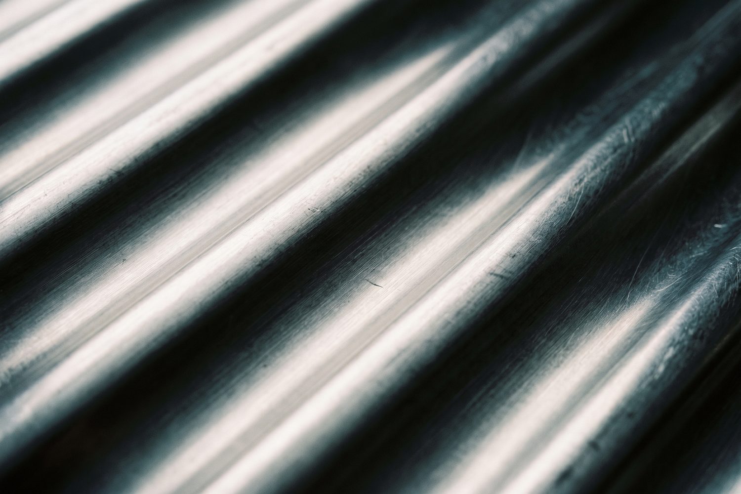 Macro of a fluted stainless steel surface in raking light