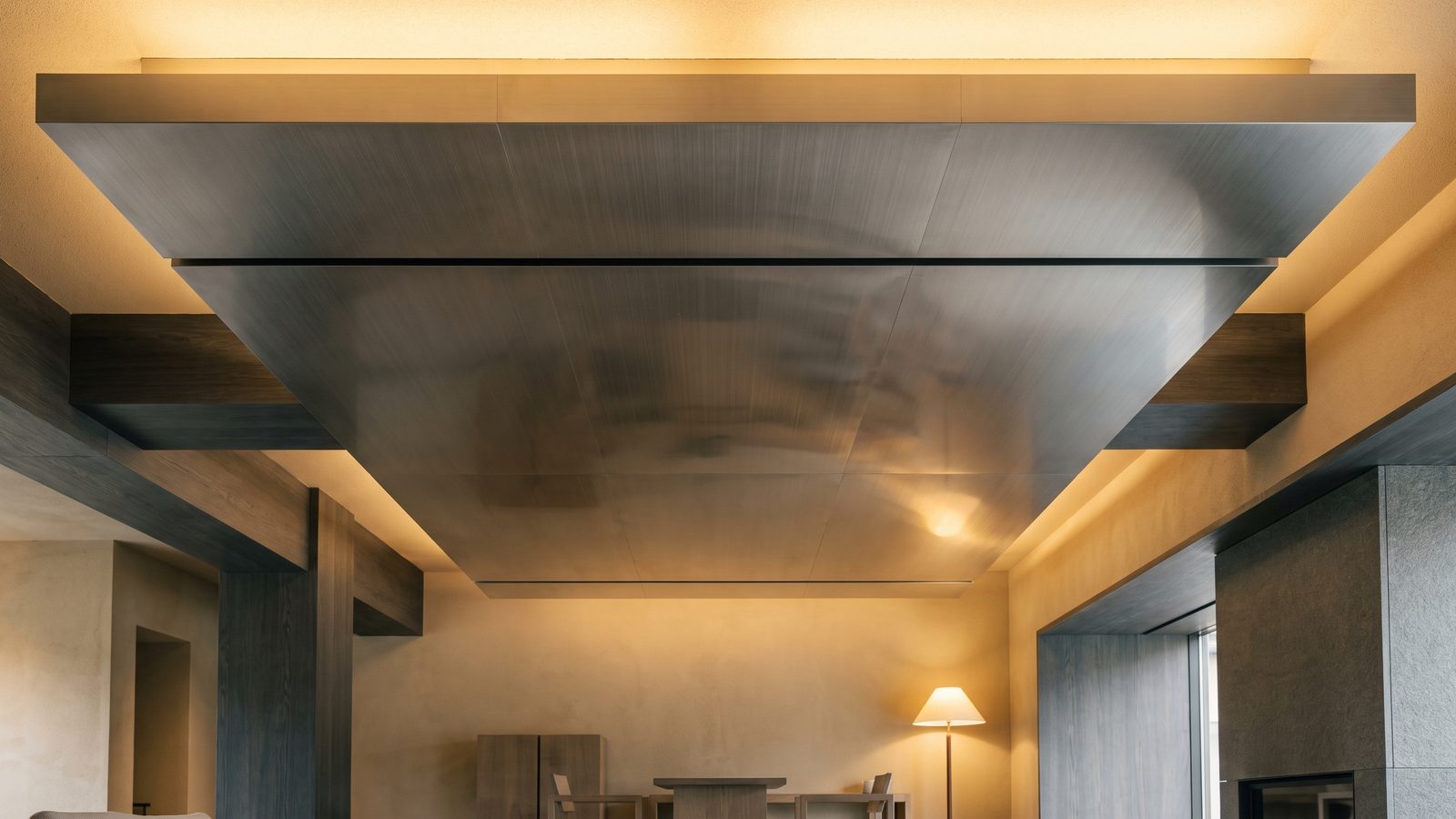 Brushed metal ceiling plane in grazing light