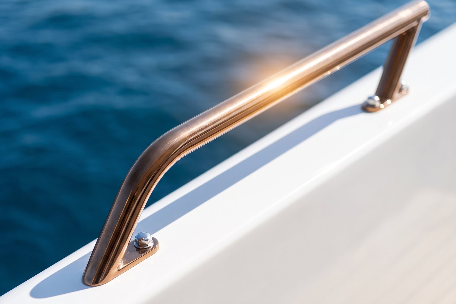 Bronze PVD stainless grab rail detail on a yacht deck