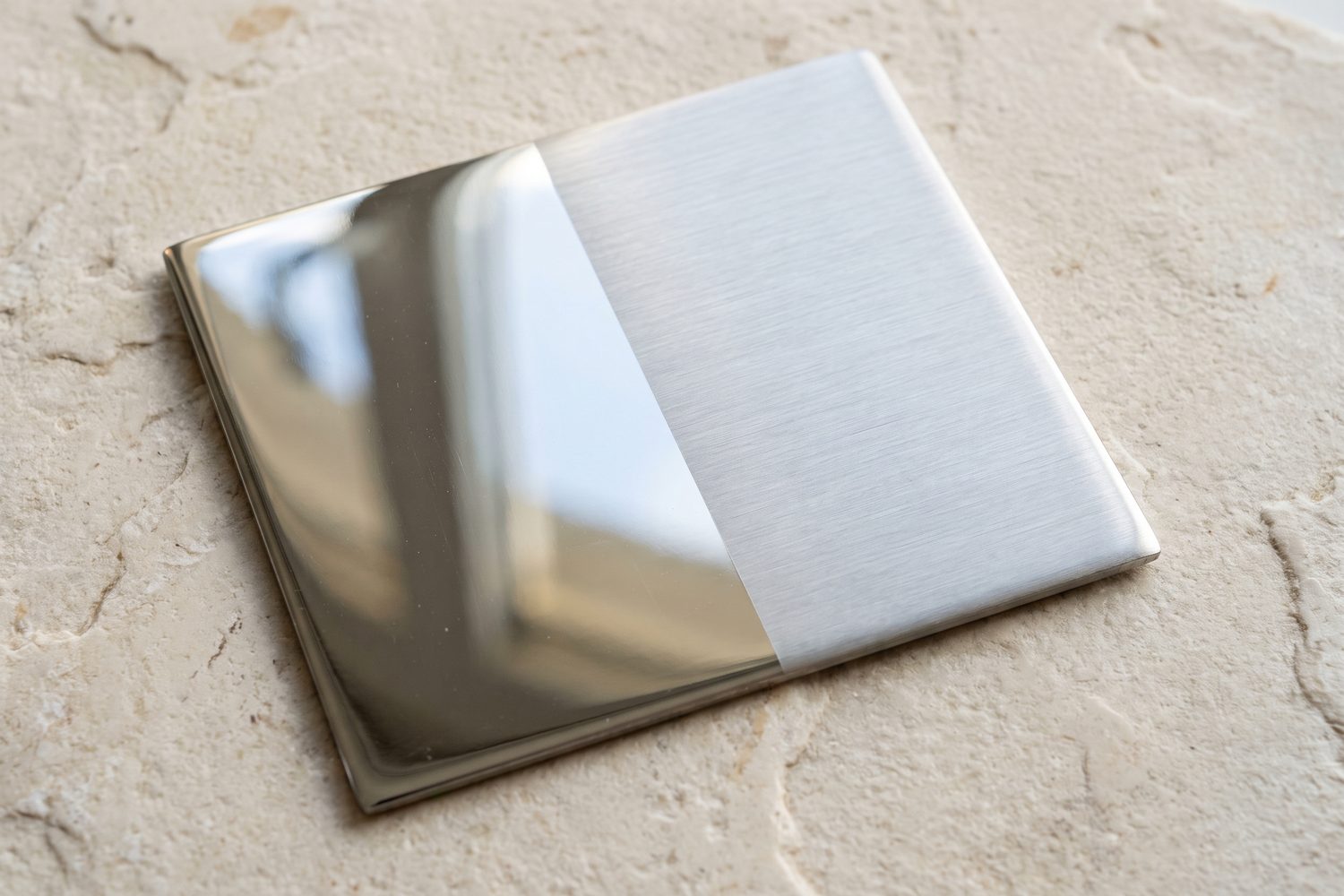 Mirror and satin metal finishes paired on one plate