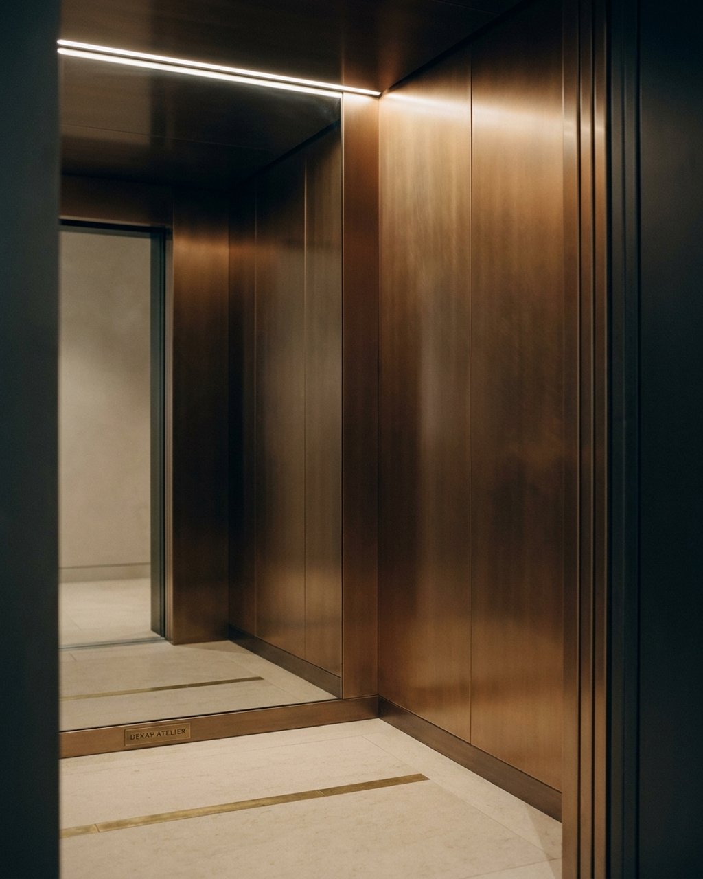 Bronze PVD-coloured stainless steel lift car interior